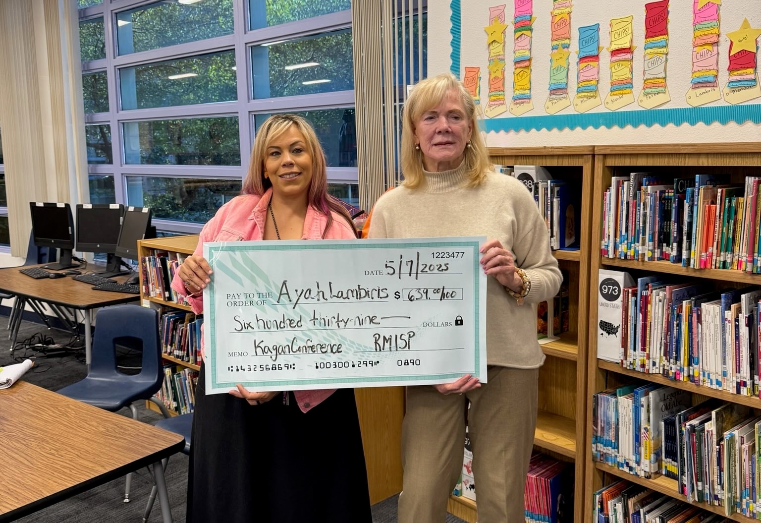 Ayah Lambiris receiving a $639 grant for Kagan Conference