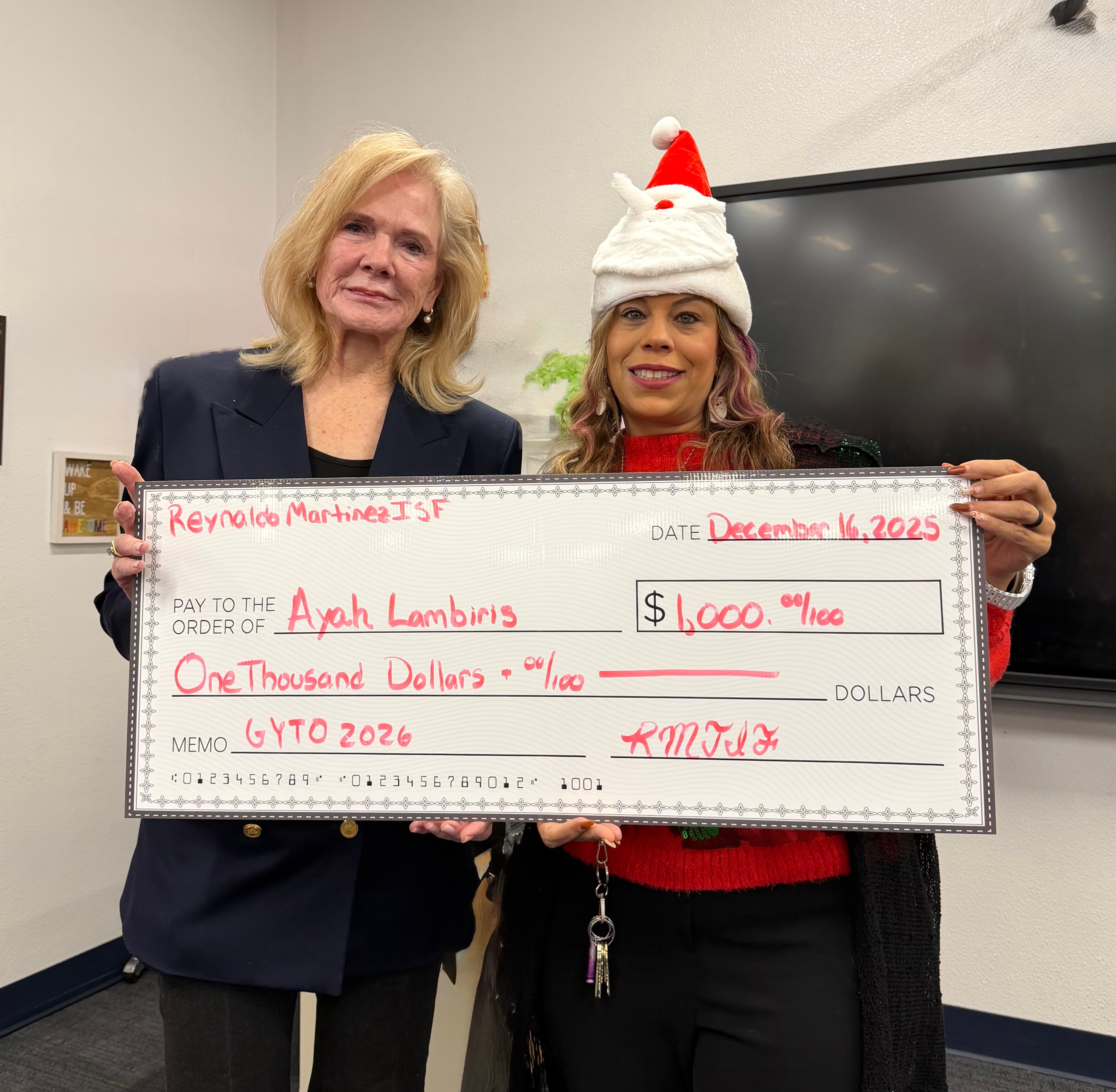 Ayah Lambiris receiving a $1,000 grant for GYTO 2026