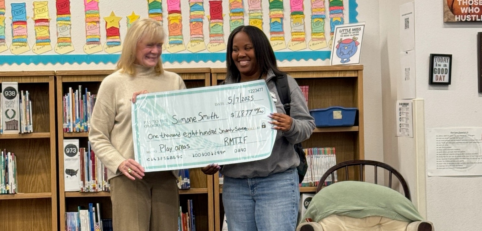 Simone Smith receiving a $1,877 grant for Play Areas